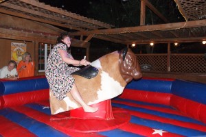 Guests having fun riding the bull at Longshadow Winery in Temecula, CA